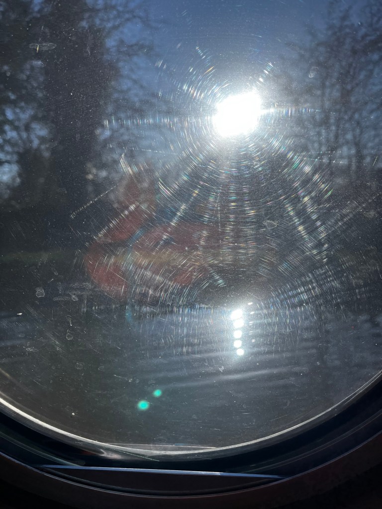 Sun shining through the port hole of And Away